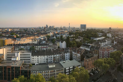 High angle view of buildings in dusseldorf, germany against sky during sunset