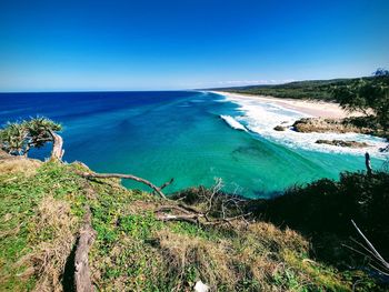 Scenic view of sea against clear blue sky