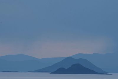 Scenic view of silhouette mountains against sky