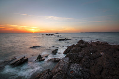 Scenic view of sea against sky during sunset