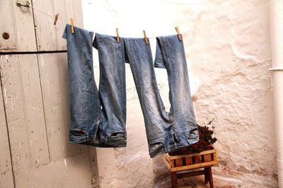 Jeans drying outside house