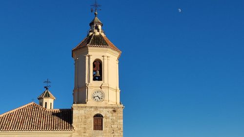 Low angle view of church against clear blue sky