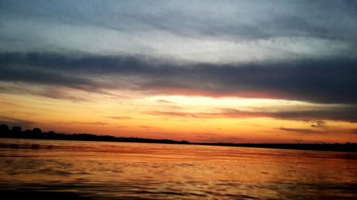 Scenic view of sea against sky at sunset