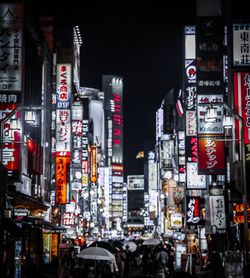 View of illuminated city buildings at night