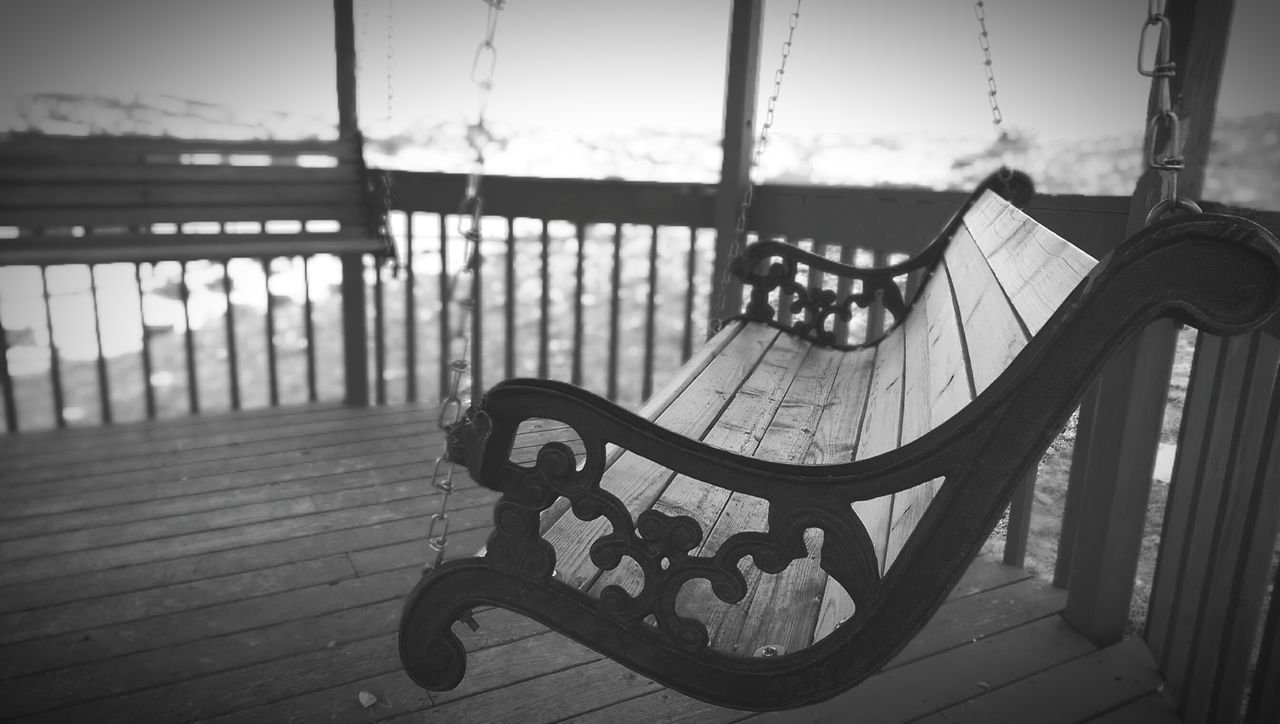 no people, railing, focus on foreground, day, carousel, close-up, outdoors, outdoor play equipment, childhood, sky