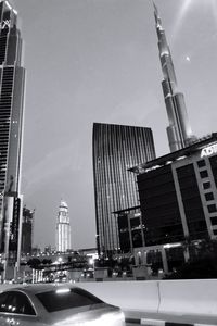 Modern buildings in city against sky