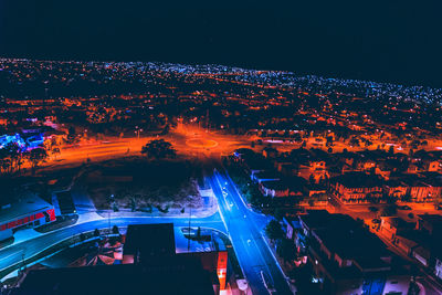 High angle view of illuminated cityscape at night