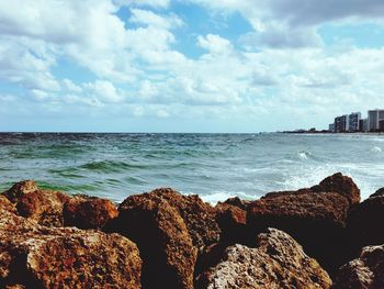 Scenic view of sea against cloudy sky