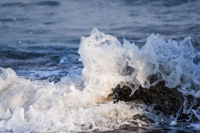 Close-up of waves splashing in sea