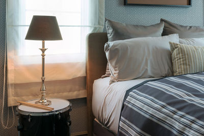 Row of electric lamp on bed at home