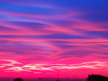 Low angle view of dramatic sky during sunset