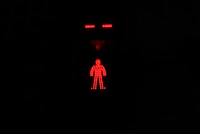 Close-up of illuminated light trails against black background