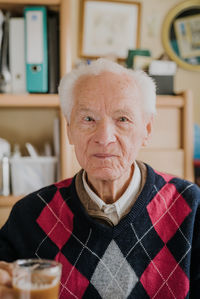 Portrait of smiling man holding coffee