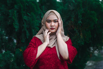 Portrait of a beautiful young woman in forest