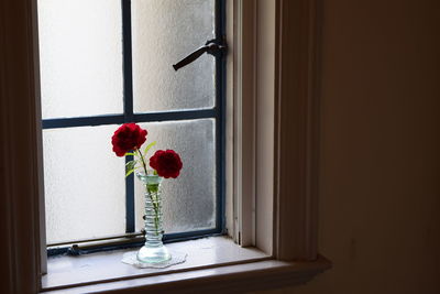 Flower vase on table at home