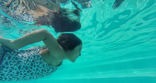 Boy swimming in pool