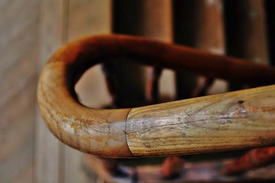 Close-up of wooden railing at stairway