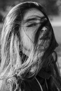 Close-up portrait of woman with hair