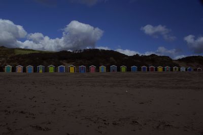 Scenic view of beach against blue sky