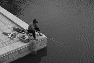 High angle view of men fishing in lake