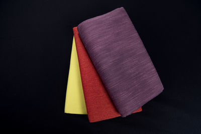 Close-up of multi colored pencils over black background