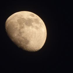 Low angle view of moon against clear sky at night