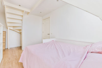 View of empty bed in bedroom