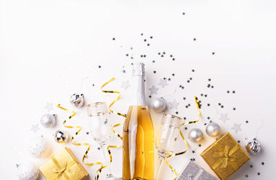 High angle view of candies on table against white background