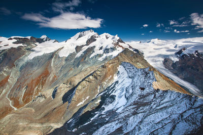 Close-up of snow covered mountains against sky