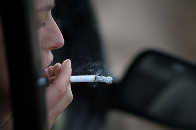 Close-up of woman smoking cigarette
