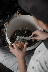 High angle view of man preparing food