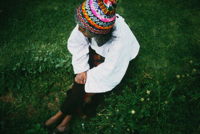 High angle view of woman wearing hat on field