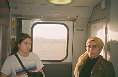 Portrait of man sitting in train