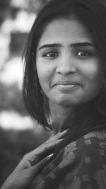 Close-up portrait of a smiling young woman