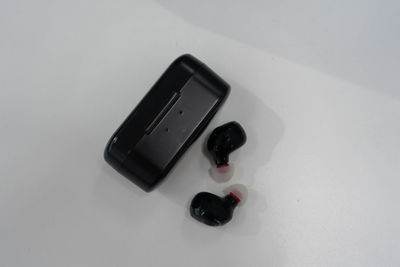 High angle view of mobile phone over white background