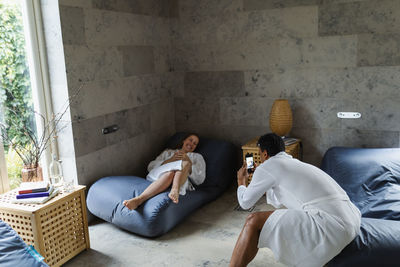 Couple relaxing together in living room