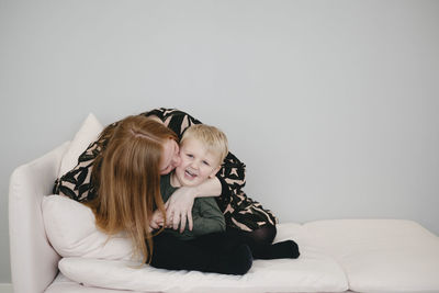 Mother with son on sofa