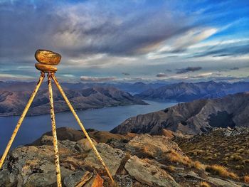 Scenic view of mountains against cloudy sky