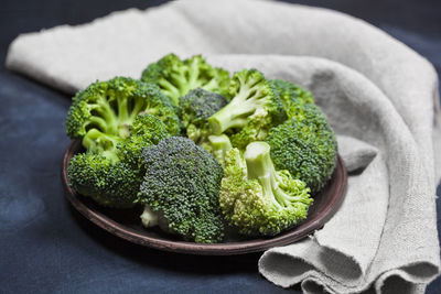 Close-up of broccoli in plate on table