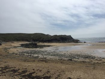 Scenic view of beach against sky