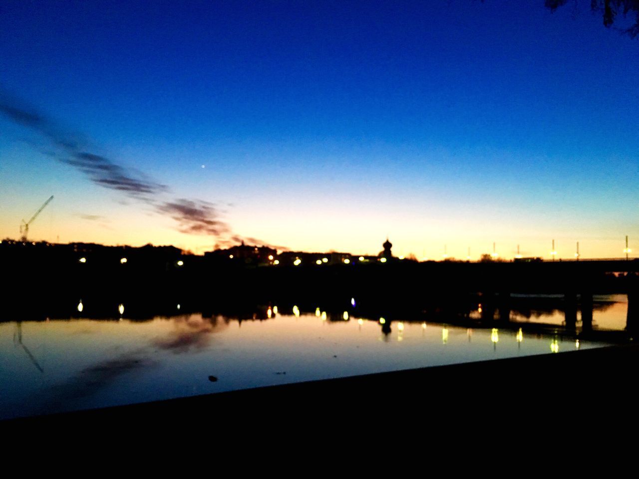 SCENIC VIEW OF LAKE AGAINST CLEAR BLUE SKY AT SUNSET