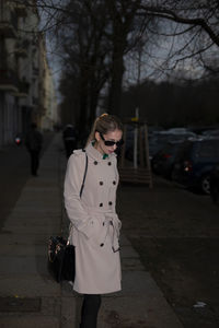 Rear view of woman standing in city