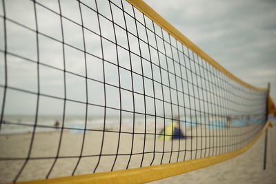 Close-up of net against the sky