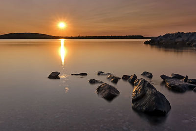 Scenic view of sea against sky during sunset