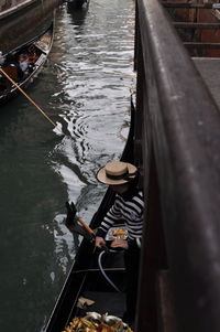 High angle view of man on boat in canal