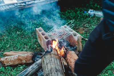 High angle view of man preparing food on wood