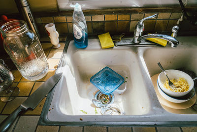 High angle view of messy kitchen sink