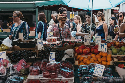 Group of people at market stall