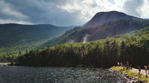Scenic view of mountain range against cloudy sky