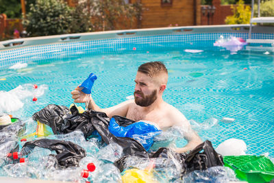 Young man in swimming pool